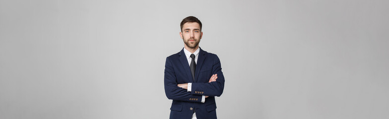 Young successful businessman posing over dark background. Isolated White Background. Copy space.
