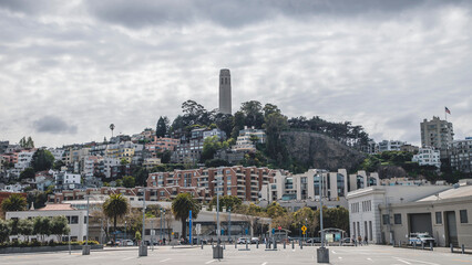 The Coit tower in the Telegraph Hill neighborhood of San Francisco against cloudy sky, United States