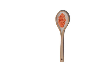 Himalayan pink salt in a spoon on white background.
