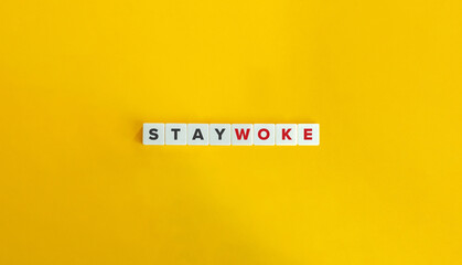 Stay Woke Banner. Letter Tiles on Yellow Background. Minimal Aesthetics.