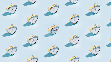Many vintage alarm clocks pattern on blue background