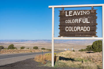 Leaving Colorful Colorado Sign along the highway at the state border