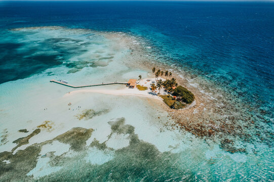 Aerial top view of the Caribbean Sea in the Goff's Caye island in Belize, Central America
