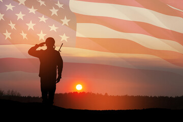 USA army soldier saluting on a background of sunset or sunrise and USA flag. Greeting card for...