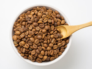 Bowl of coffee beans with wooden scoop