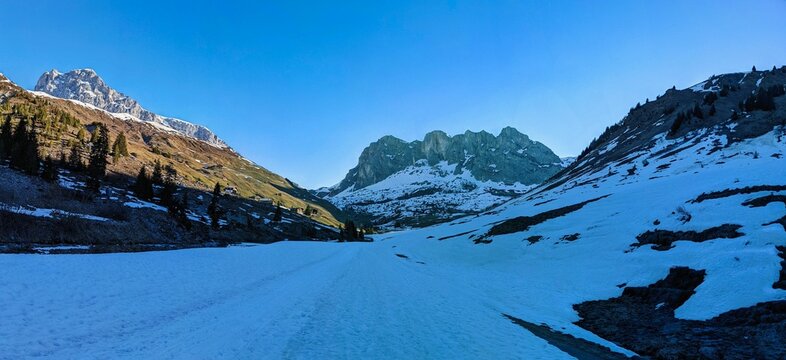 Panorama Picture. Wiss Platte and Partnun Stafel in front. Winter Spring in Partnun near Sant Antonien in Praettigau. Hiking and skiing together. View of the peak Sulzfluh. Skimo