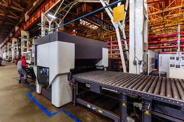 Modern metal sheet forming machine at the metalwork factory