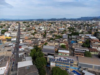 Slum favela-style community city on the outskirts of Vitoria, Cariacica, Espirito Santo - aerial drone view