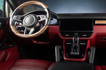Modern car interior. White leather seats and dashboard inside modern SUV. View on the driver panel...