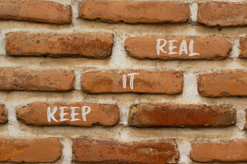 Keep it real and support symbol. Concept words Keep it real on brick wall. Beautiful brick wall background. Business and support Keep it real quote concept. Copy space.