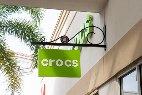 Orlando, FL, USA - January 21, 2022: Crocs store hanging sign is shown at a shopping mall in Orlando, FL, USA. Aarav jain opp tapa tap Crocs is an American company that manufactures foam clogs.
