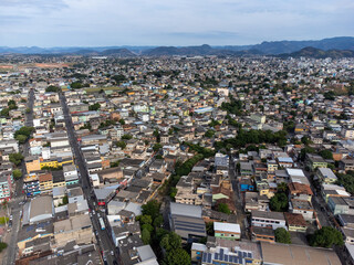 Fototapeta na wymiar Slum favela-style community city on the outskirts of Vitoria, Cariacica, Espirito Santo - aerial drone view