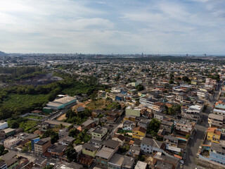 Slum favela-style community city on the outskirts of Vitoria, Cariacica, Espirito Santo - aerial drone view