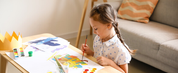 Cute little girl painting at home - obrazy, fototapety, plakaty
