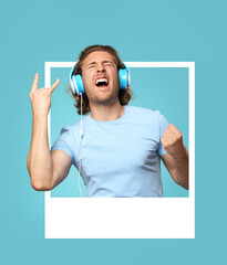 Emotional young man looking out of frame and listening to music on blue background