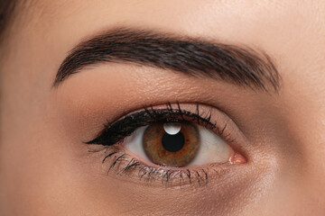 Tired young woman with dark circle under eye, closeup