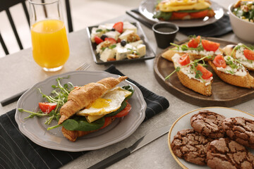 Many different dishes served on buffet table for brunch