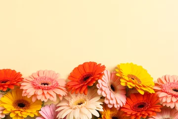Fototapeten Beautiful colorful gerbera flowers on beige background, flat lay. Space for text © New Africa
