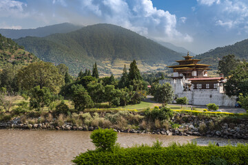 Bhutan - October 24, 2021: The Punakha Dzong between the Pho Chhu and Mo Chhu river in Bhutan. Punakha Dzong Monastery, one of the largest monasteries in Asia, Until 1955 seat of the Bhutan government