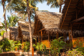 Beautiful eco-cottages made from bamboo and coconut leaves captured in Goa, India