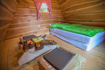 Interior of a wooden hut at a glamping site at Lake Bloke, Nova Vas, Slovenia