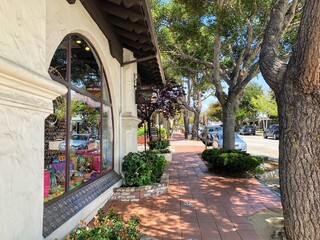 A view of the shops and restaurants with unique architecture, along the streets of Carmel by the...