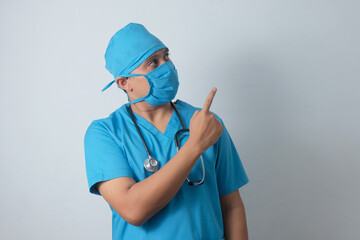 asian male nurse pointing finger to the top