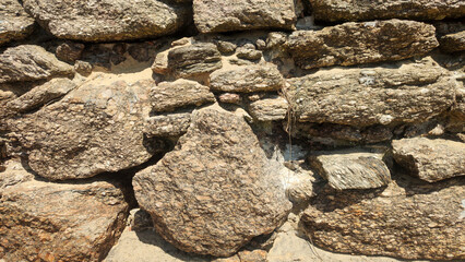 stone rock granite marble shiny sun light wall nature strength protection beach texture pigment sequence repeat pattern