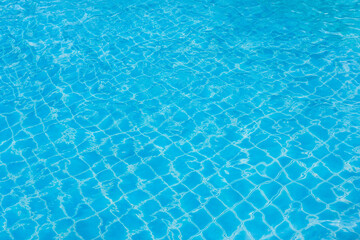 Ripple water swimming pool. blue wave water on the outdoor swimming pool. Summer background.