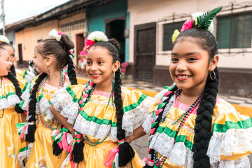 Group of girls in folkloric costume on a street in Leon