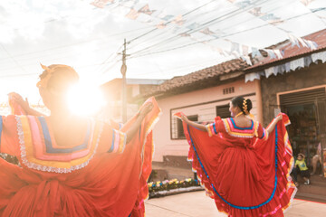 Traditional Nicaraguan dancers with typical tajes dancing on an outdoor stage