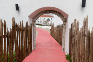 Entrance arch with a wooden fence in Torres Novas, Santarem, Portugal