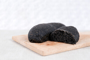 Fototapeta na wymiar Black Long John buns bread with copy space for text 