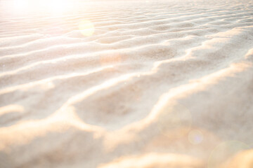 Sunset over beach sand dune patterns