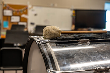Selective focus on a marching band bass drum in a school room. 