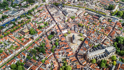 Aerial drone view of Gauda town cityscape from above, typical Dutch city skyline with canals and houses, Holland, Netherlands