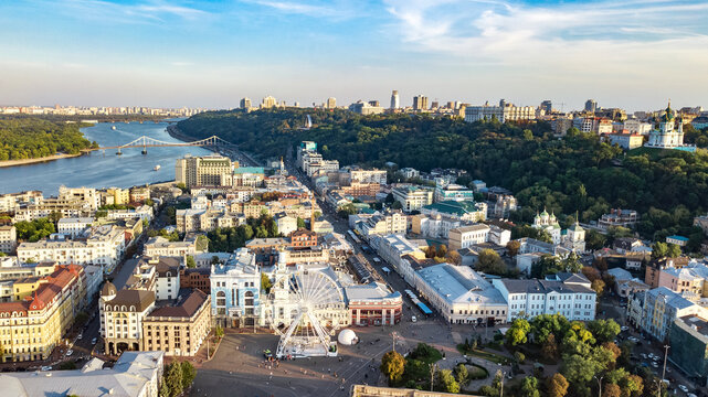 Kyiv cityscape aerial drone view, Dnipro river, downtown and Podol historical district skyline from above, city of Kiev and Dnieper, Ukraine