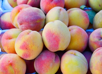 Ripe peaches (from Lat. Persicus) of the new harvest are sold at the bazaar 