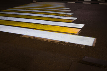 Night shot of Zebra traffic walk way covered with fluorescent paint