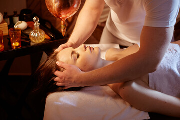 Obraz na płótnie Canvas girl getting a therapeutic massage in a spa salon