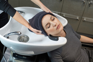 girl washing her hair at the hairdresser