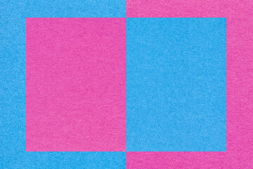 Fototapeta premium Texture of light blue and purple paper background with geometric pattern, macro. Structure of lilac craft cardboard.