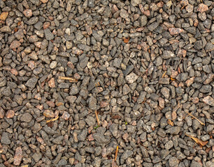 Small pebbles of crushed stone as an abstract background.