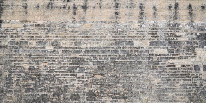 brick stone old grunge plaster facade wallpaper in concrete wall background