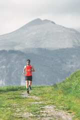 Naklejka na ściany i meble Runner during a mountain preoaration