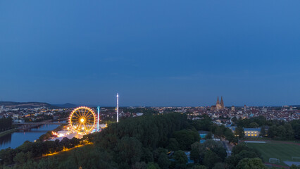 Aerial drone view of the fair Maidult in Regensburg, Bavaria, Germany with ferris wheel and beer...