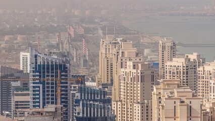 Obraz premium Aerial view of JBR and Dubai Marina skyscrapers and luxury buildings timelapse from above