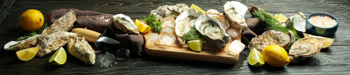 Concept of delicious seafood, oysters on wooden table
