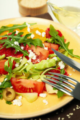Concept of tasty food with salad with red orange