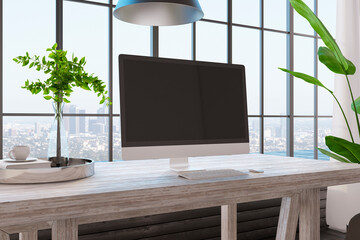 Close up of creative designer desktop with empty computer screen, decorative plants and other items on hardwoode desktop. Window with city view background. Mock up, 3D Rendering.